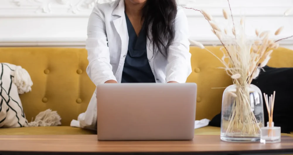 Online counsellor based in Croydon, working on laptop